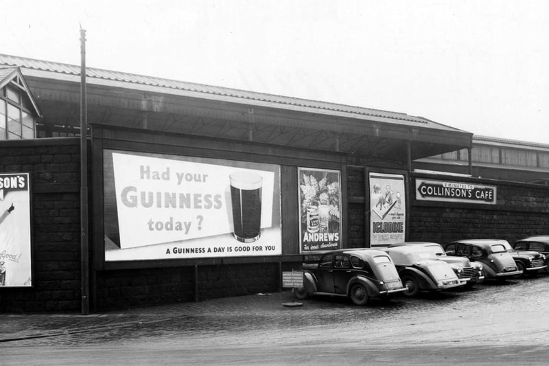 Cars parked along Central Station wall in December 1952. On the wall are advertising hoardings for Guinness, Andrews Liver Salts and Iglodine Antiseptic, also a sign pointing to Collinson's Cafe.