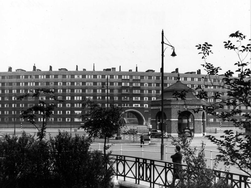 June 1952. View looking east-south-east at Quarry Hill Flats and Eastgate Roundabout. The roundabout has a hexagonal petrol station in the middle, with arches on each face.