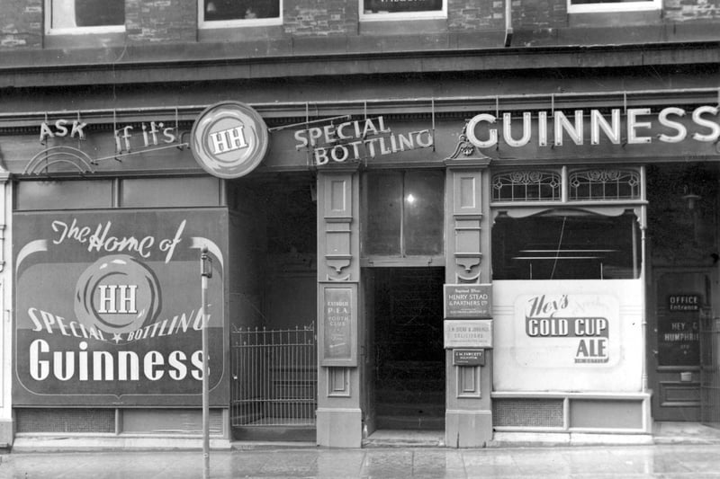 Cookridge Street in November 1952 showing H. Stead and Partners Ltd, business transfer agents, and J.W Stead & Jobbings, solicitors. Next door is Hey & Humphries Ltd, ale and porter bottlers.