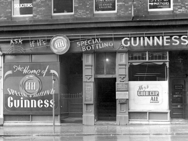 Cookridge Street in November 1952 showing H. Stead and Partners Ltd, business transfer agents, and J.W Stead & Jobbings, solicitors. Next door is Hey & Humphries Ltd, ale and porter bottlers.