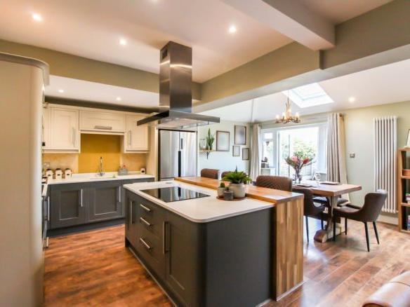 The kitchen is the breathtaking main feature of this house. The kitchen living space is impeccably designed throughout and split into four sections: kitchen, dining, play and living area.