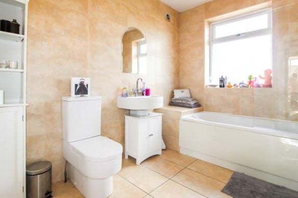 The large family bathroom has a three piece suite comprising; panelled bath, vanity wash hand basin with mixer tap and a low level flush w/c.