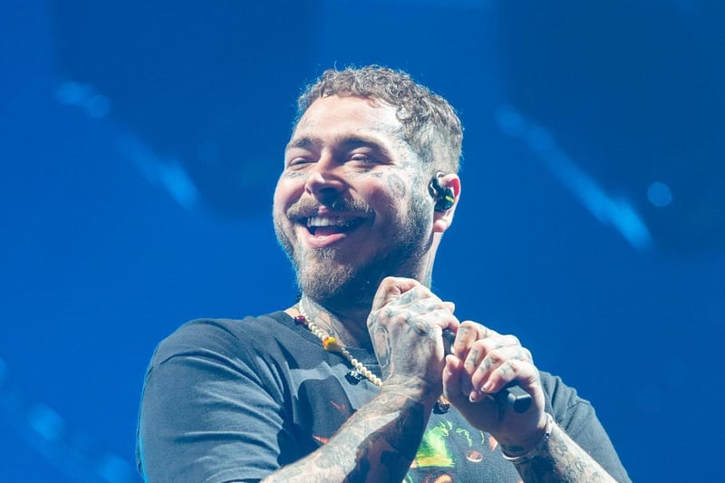 Post Malone laughing along with the crowd as he headlines Leeds Festival