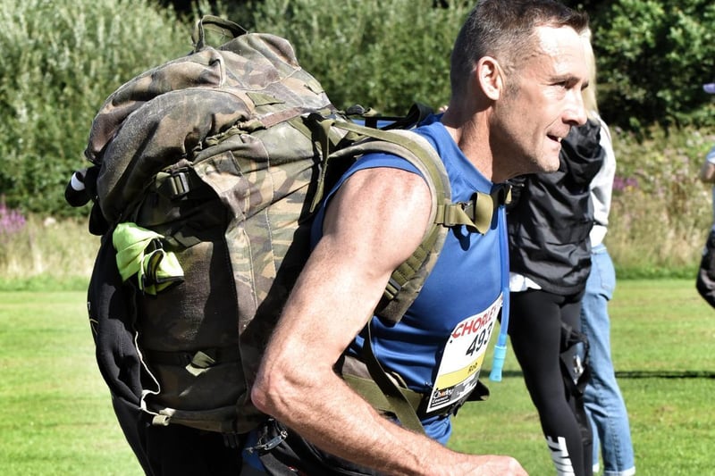 This runner completed the race hauling a hefty rucksack on his back
