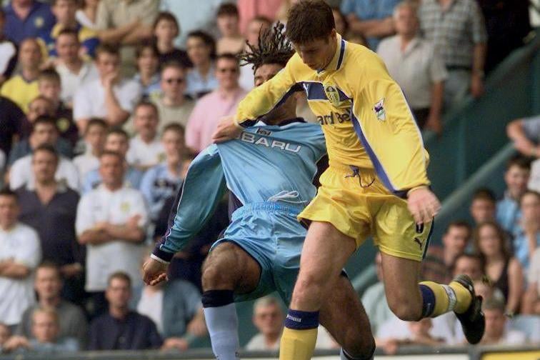 Michael Bridges holds off a challenge from Coventry City's Richard Hall.