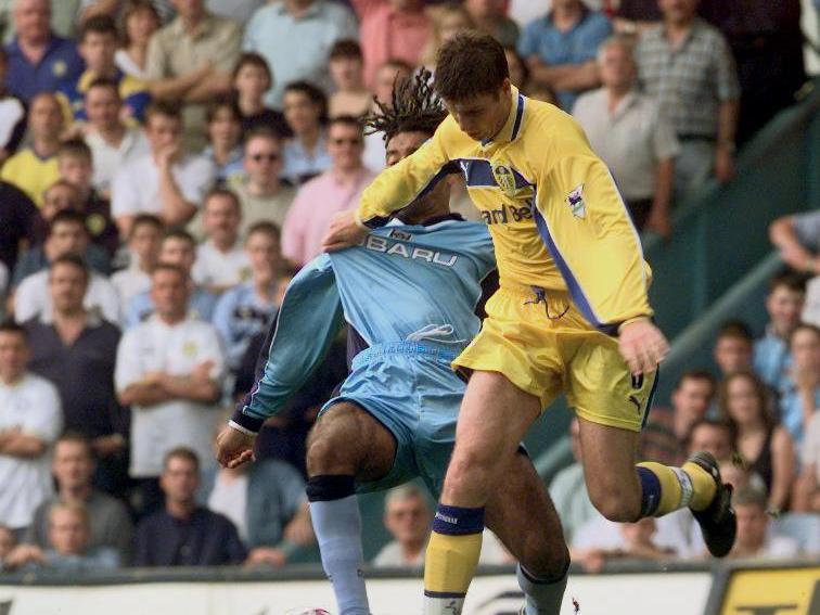 Michael Bridges holds off a challenge from Coventry City's Richard Hall.