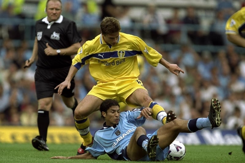 Harry Kewell is challenged by Coventry City's Youssef Chippo.