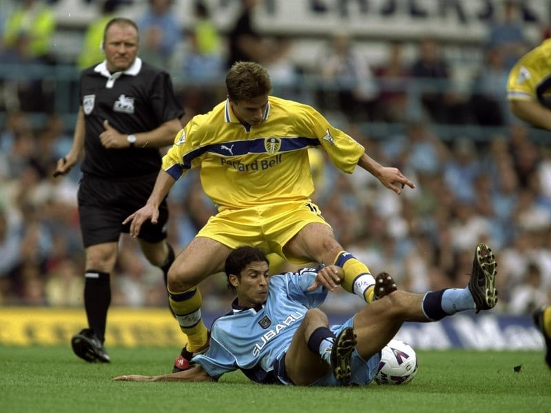 Harry Kewell is challenged by Coventry City's Youssef Chippo.