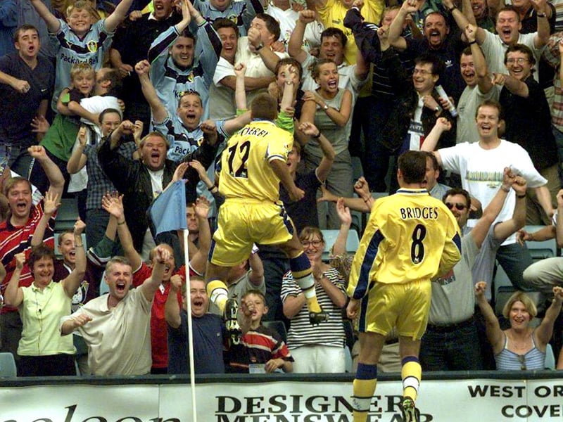 Darren Huckerby celebrates with the travelling support after scoring against his former club.