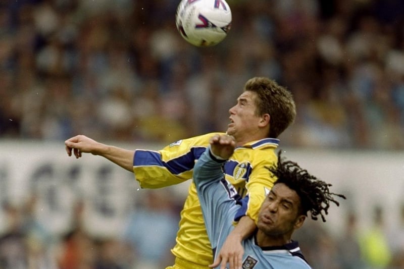 Harry Kewell rises above Coventry City's Richard Shaw.