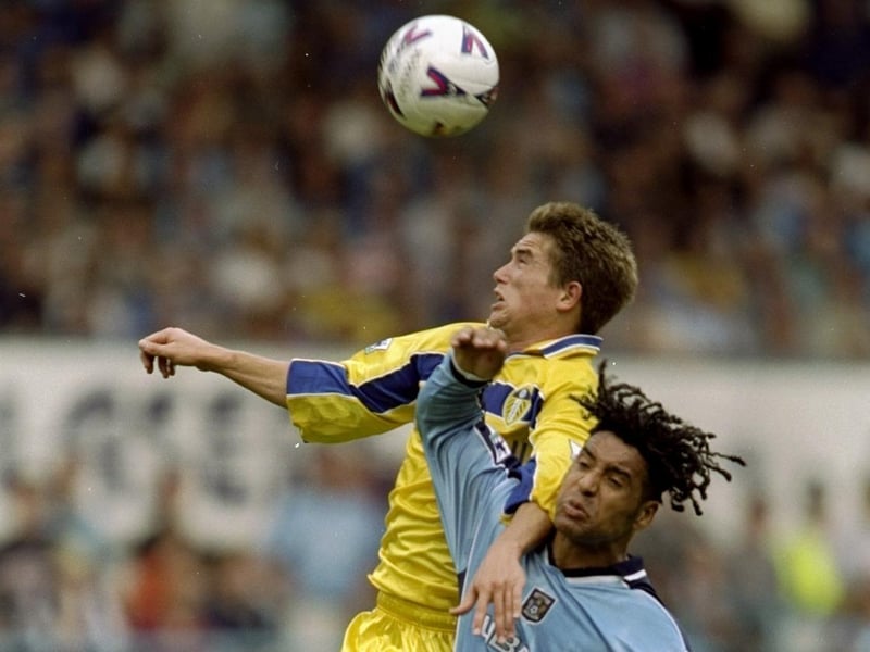 Harry Kewell rises above Coventry City's Richard Shaw.