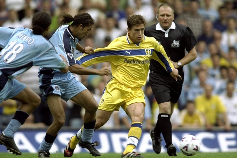 Harry Kewell is held back by Coventry City's Mustapha Hadji.