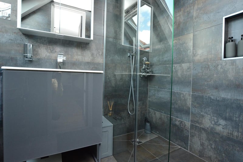 The en-suite is fitted with high specification fittings including a Keuco walk-in shower, wash hand basin and a Noken wall hung WC. There is also an enclosed walk-in wardrobe space.