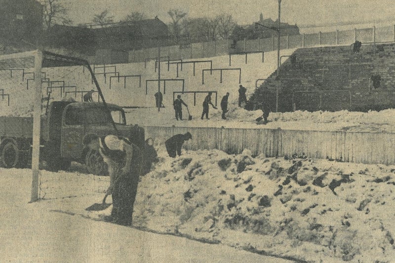 Clearing the pitch for the visit of Spurs, February 1953.