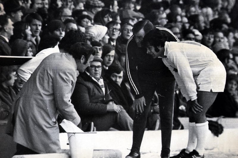Mick Bates receives instructions from Don Revie during a game at Elland Road.