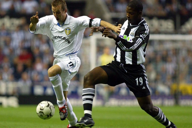 Lee Bowyer holds of the challenge of Newcastle United defender Titus Bramble.