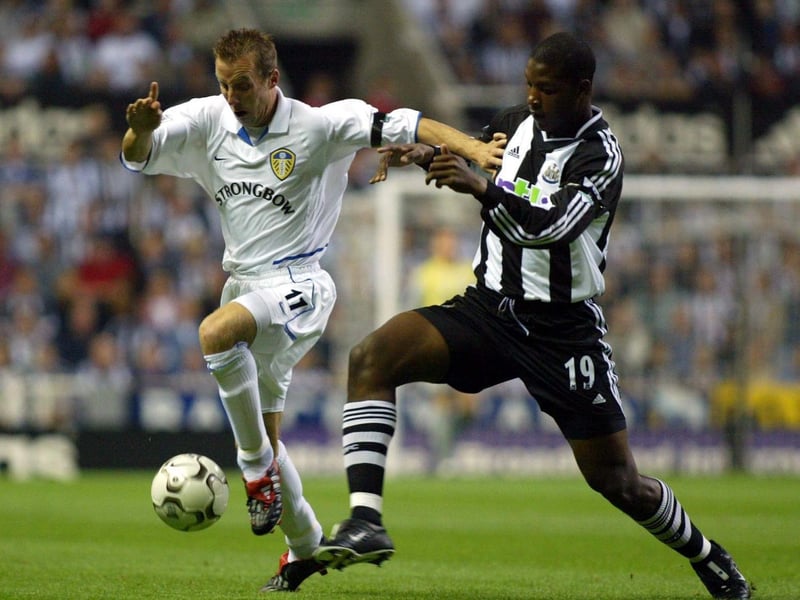 Lee Bowyer holds of the challenge of Newcastle United defender Titus Bramble.