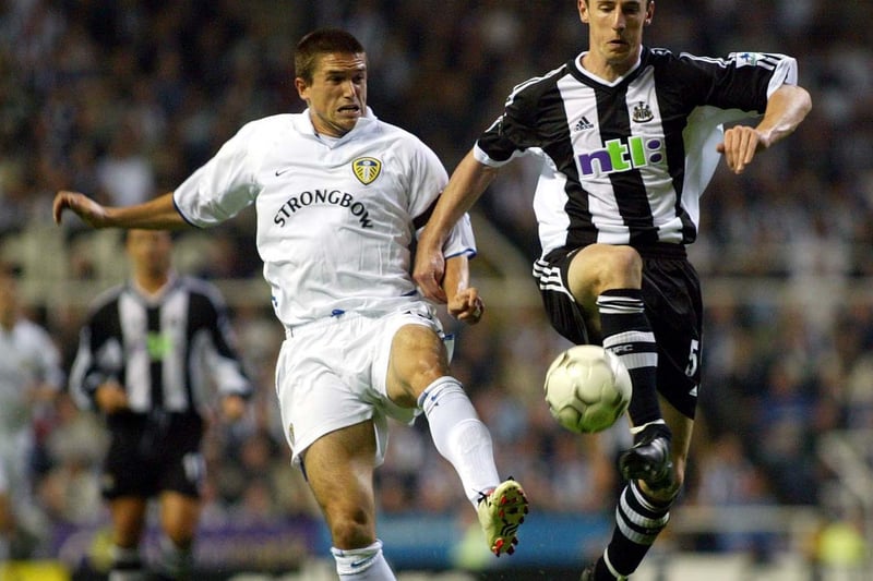 Harry Kewell and Newcastle United's Andy O'Brien battle for the ball.