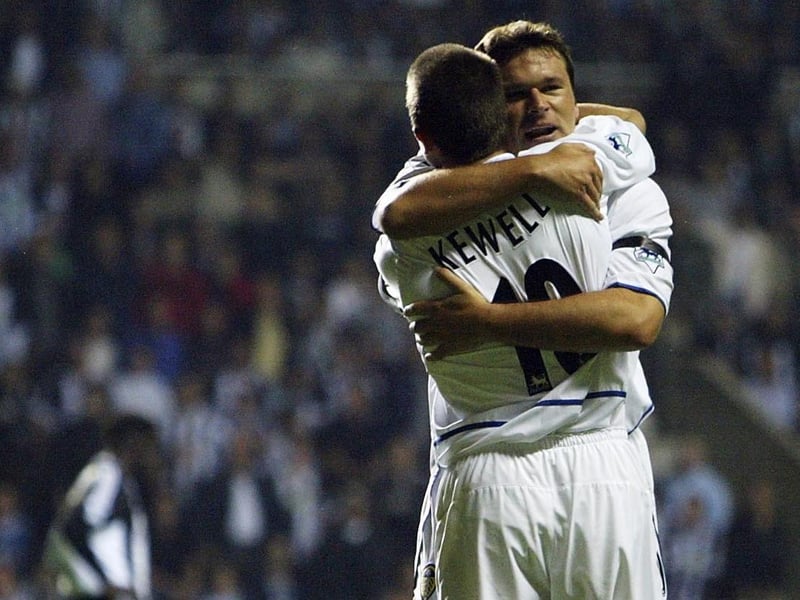 Mark Viduka celebrates scoring with teammate Harry Kewell.