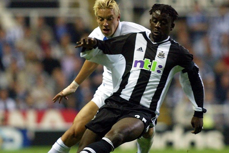 Alans Smith hunts down Newcastle United's Olivier Bernard.