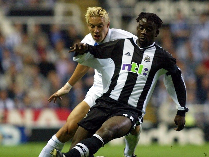Alans Smith hunts down Newcastle United's Olivier Bernard.