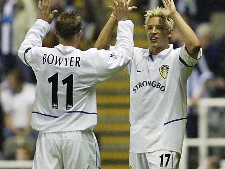 Striker Aaln Smith celebrates what proved to be the winning goal with Harry Kewell.