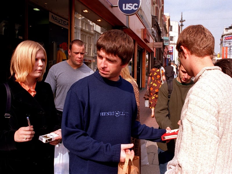 Noel Gallagher is besieged by autograph hunters on Briggate.