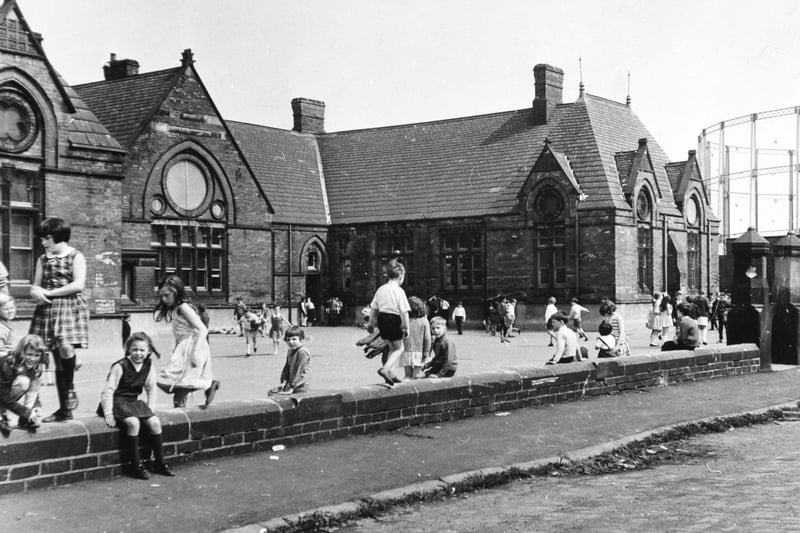 Children on the playground at Sheepscar School in June 1968. The gasometer came be seen in the background.