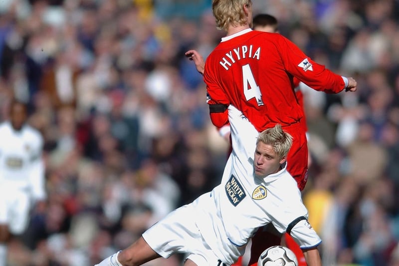 Striker Alan Smith clashes with Liverpool defender Sami Hyypia.
