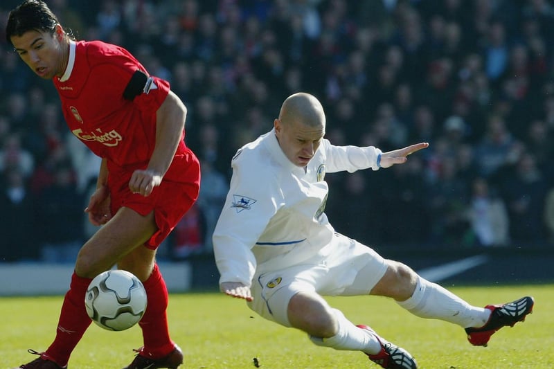Seth Johnson clashes with Liverpool striker Milan Baros.