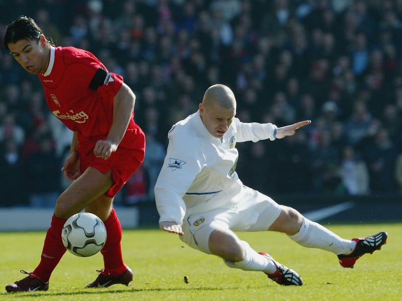 Seth Johnson clashes with Liverpool striker Milan Baros.