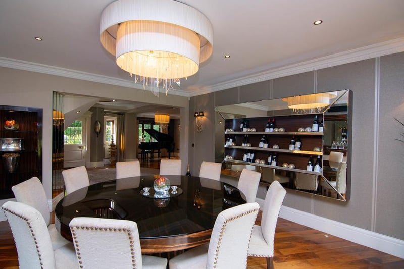 The formal dining room is a fantastic space to sit and converse with friends. The current owners have a large round dining table, with wine cabinet on display - perfect for hosting parties.