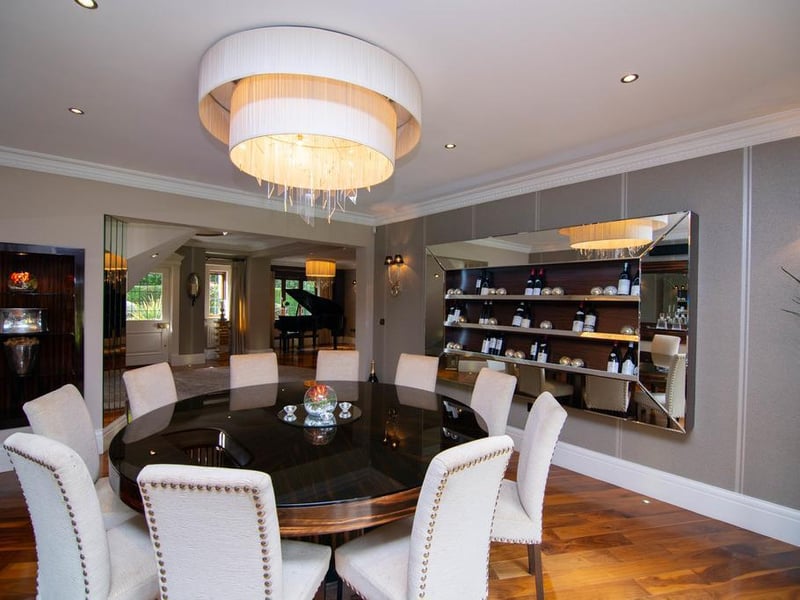 The formal dining room is a fantastic space to sit and converse with friends. The current owners have a large round dining table, with wine cabinet on display - perfect for hosting parties.
