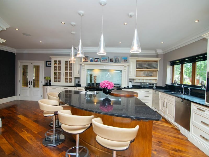 The impeccably designed open plan living area is the hub of the home. The kitchen was designed and installed by Jeremy Wood Interiors of Wetherby and is appointed with the finest range of Miele appliances throughout and a large wine refrigerator.