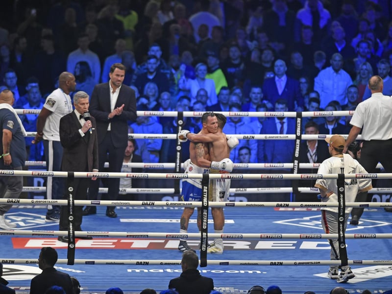 The boxers exchange a respectful hug