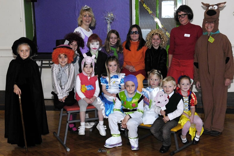 Pictured from left in film character costumes are teaching assistant Helen Mills, Deputy Headteacher Sally Pitts and teaching assistant Sue Blakey with pupils at Starbeck Primary School.