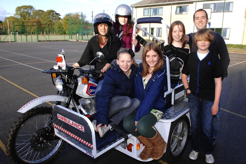 Pupils from St Aidans High School hope to raise enough money to purchase an E Ranger Mobile Ambulance for a community in Uganda. Pictured with the bike are clockwise from left Global Dimension teacher Claire Lomax, Rachel Convery, Livvi Bridger, teacher Mr Avery, Mark Proudler, Isabelle South and Tilly Rhodes.