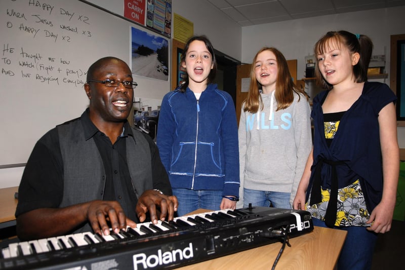 Pupils from St Aidan's High School receive a Gospel masterclass with band leader Leroy Johnson of RJP Community Choir during their fundraising Africa Day. From 2nd left are Year 7 girls Alice Green, Tilly Towers and Rebecca Newell.