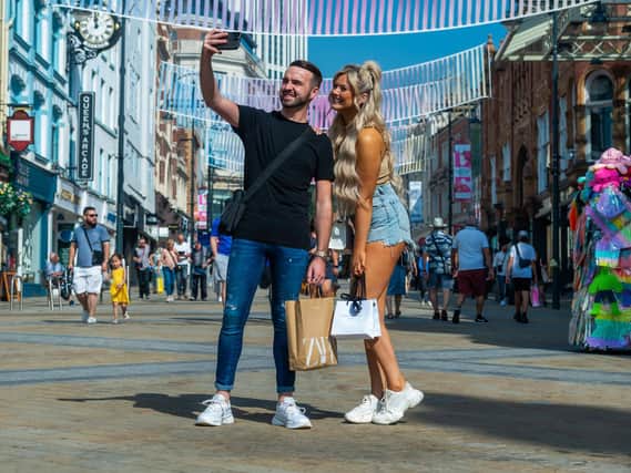 Leeds shoppers Alex Thomas and Rachel-Amey snap away in the sunshine.