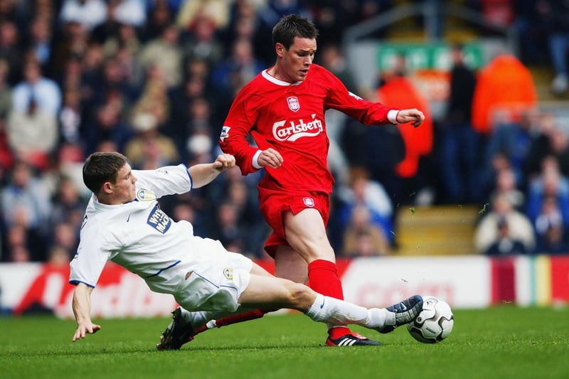 James Milner tackles Liverpool's Steve Finnan during the Premiership clash at Anfield in October 2003. The Whites lost 3-1.