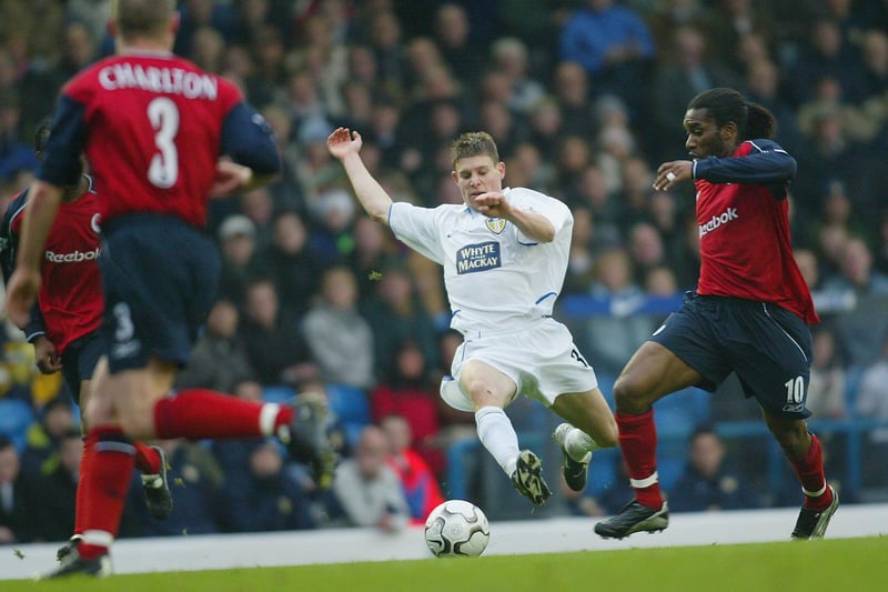 James Milner challenges Jay Jay Okocha during Leeds United's Premiership clash against Bolton Wanderers at Elland Road in November 2003.