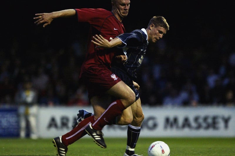 James Milner holds the ball up from York City's Andrew Jordan during the pre-season friendly at Bootham Crescent in July 2003. The game ended in a 1-1 draw.
