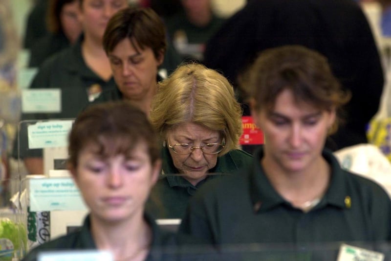 Staff at Asda's Pudsey Owlcotes Centre store pause to reflect on the horrific events during a three minute silence.