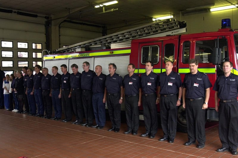 Firefighers and support staff at Leeds Fire Station observe a minutes silence.