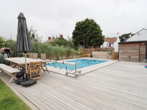 A swimming pool with decking surround comes with this cottage for sale in Hunmanby
