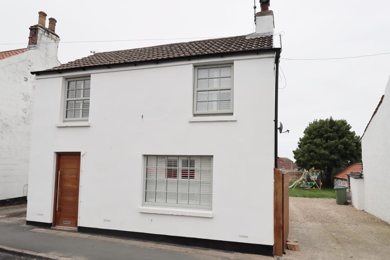 This village centre home has open plan living space, ideal for a family