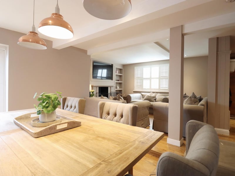 The spacious dining and lounge areas within the cottage.