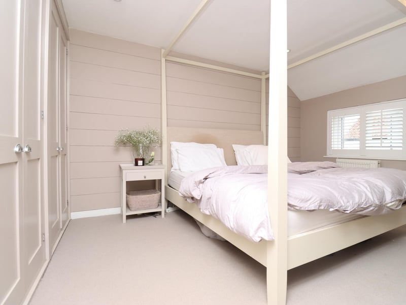 A stylish cottage bedroom.