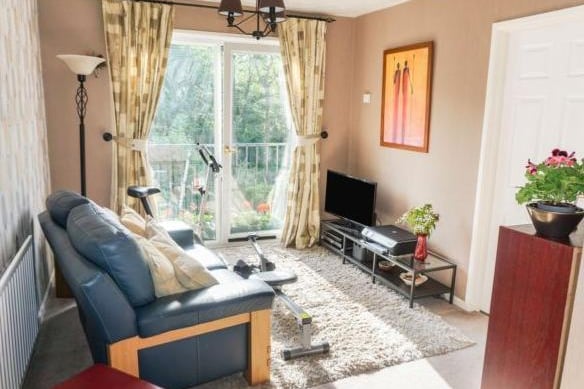 The sitting room is also on the ground floor. It is at the rear of the property and benefits from a Juliet balcony and great views of the woodland.