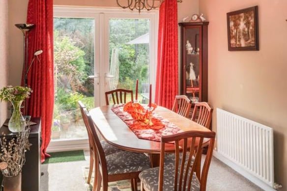 There is a very large Dining Room with double doors leading out to the garden.